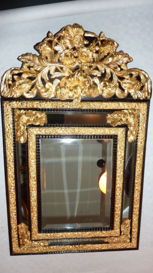 Gilded and restored cushion mirror