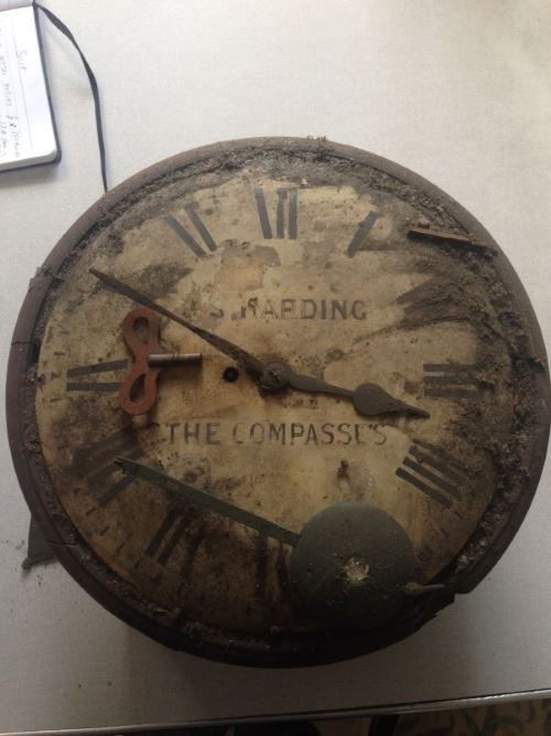 Dirty and dusty fusee clock after being in a cellar for apparently 50 to 60 years