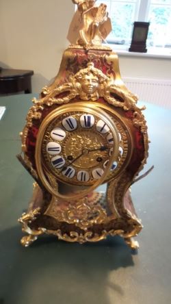 Boulle clock before restoration with bent bezel